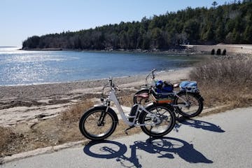 two bikes next to a beach