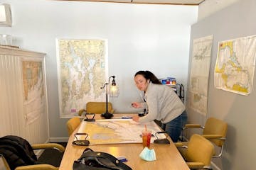 a person sitting at a desk in a room