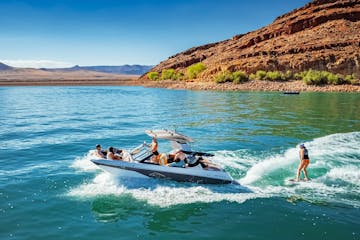 a group of people riding skis on a body of water