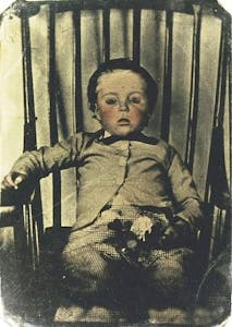 an old photo of a boy