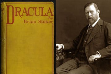 Bram Stoker wearing a suit and tie sitting in a chair