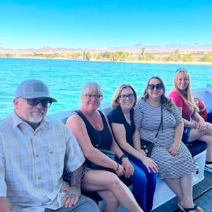 a group of people sitting on a river cruise boat