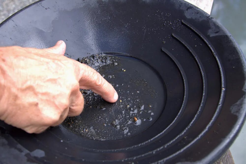 a man cooking in a pan