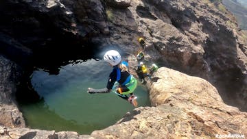 a group of people canyoning
