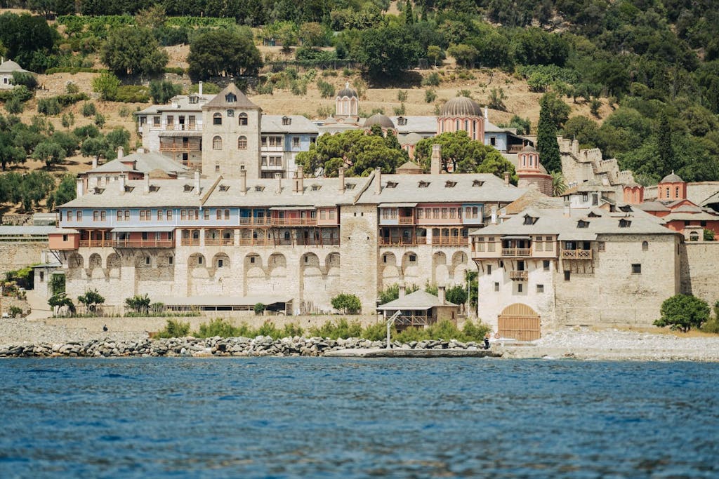 Aerial view of Xenophontos Monastery, a historic Byzantine monastery perched on the cliffs of Mount Athos.