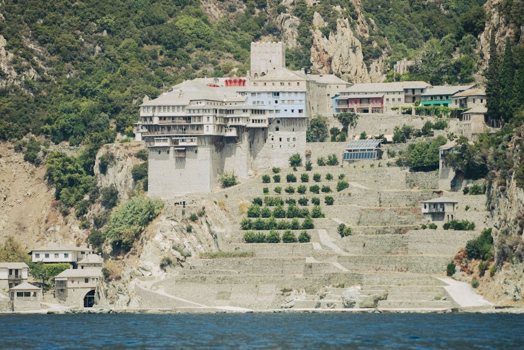 erial view of Dionysiou Monastery perched on a rocky cliff overlooking the sea