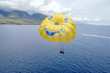 a parachute is sitting next to a body of water