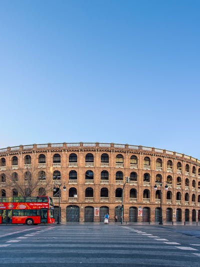 A bus parked in front of Plaza de Toros