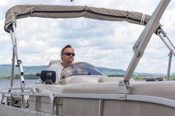 a man sitting on a boat