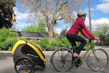 a person riding on the back of a bicycle