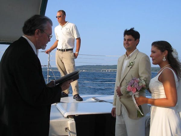 A couple getting married on the Nauti-Cat