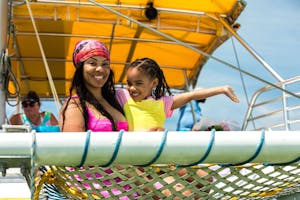 A mother and daughter smiling aboard SV Footloose