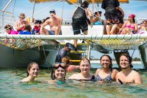 A group of happy guests snorkeling by SV Footloose