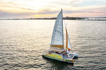 SV Footloose sailing in the Gulf of Mexico during sunset