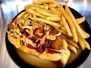 a hot dog and french fries on a plate