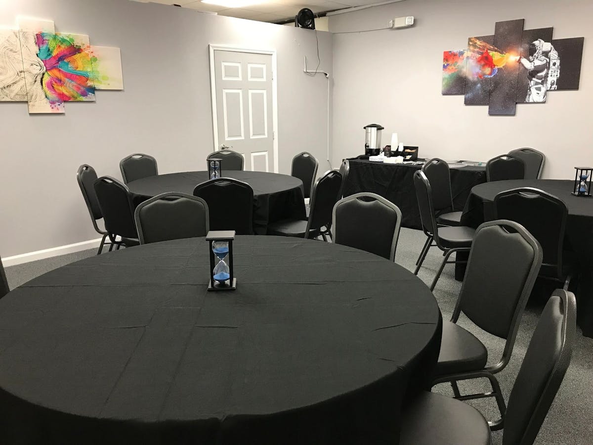 round tables with chairs in a room