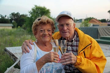 A old man and woman cheers