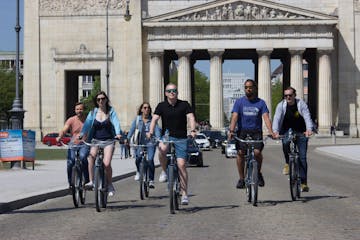 a group of people riding on bicycles