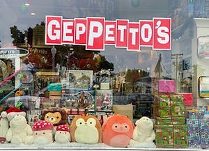 a group of stuffed animals on display in a store