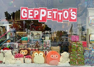 a group of stuffed animals on display in a store