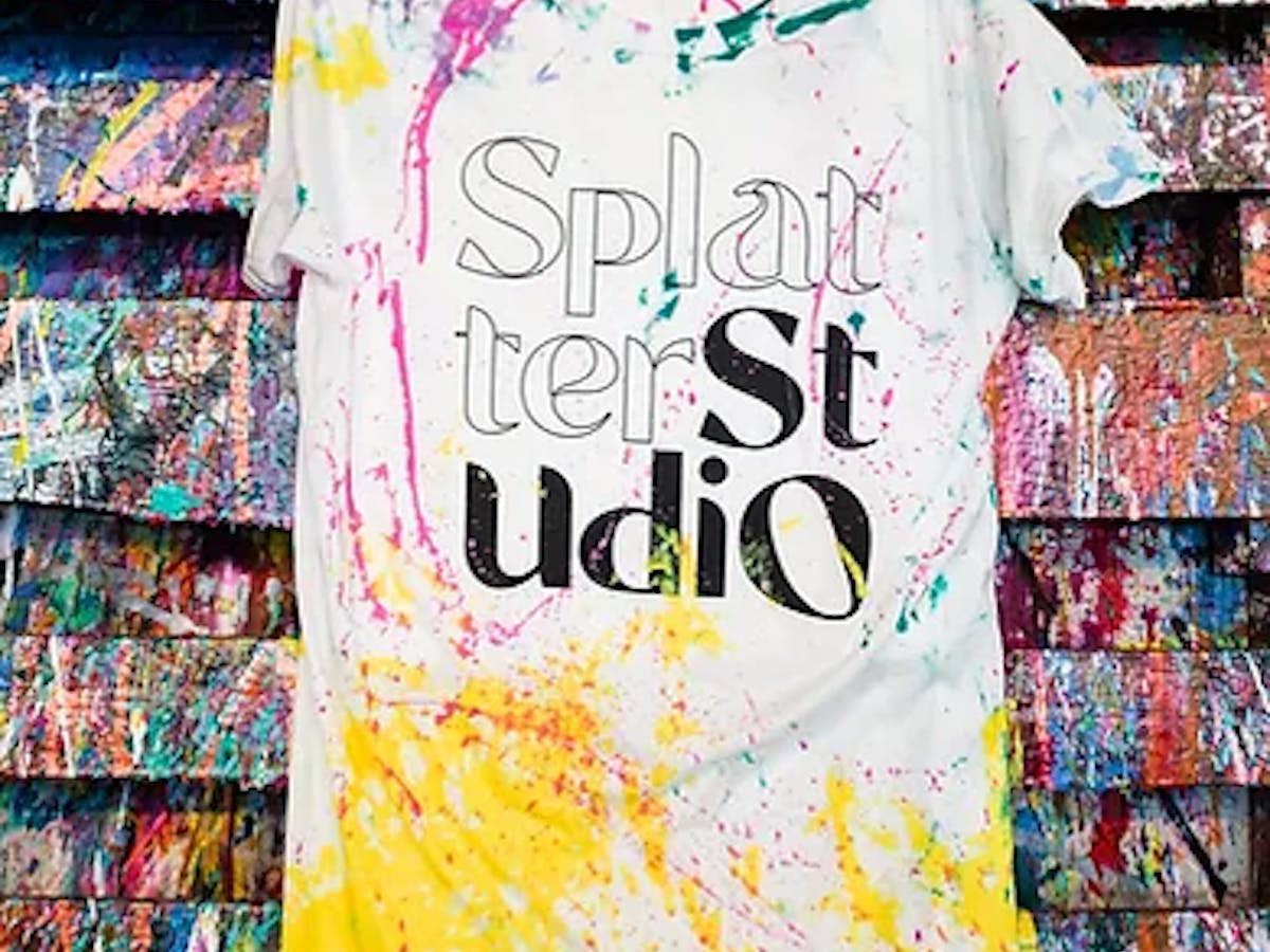a t-shirt with paint splattered on it