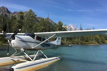 a small plane sitting on top of a lake