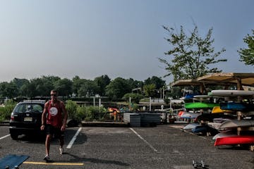 a group of people standing in a parking lot