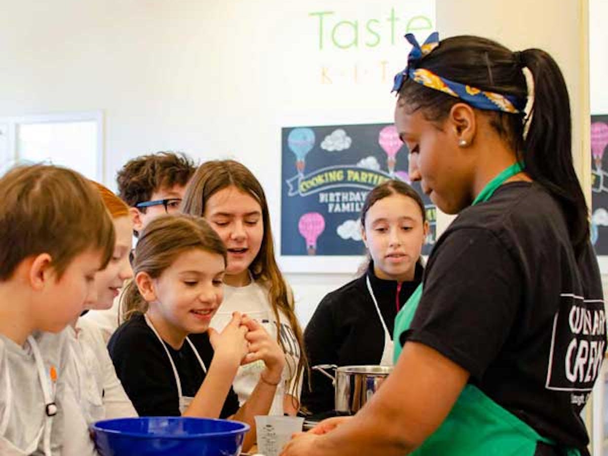 Female Chef with kids cooking camp class