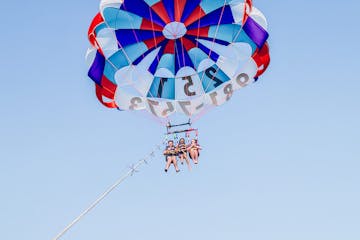 three people parasailing