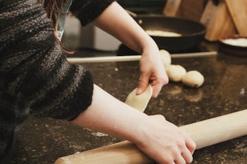 a woman holding a rolling pin