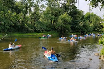 A group of People with kayak and Paddle