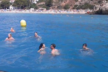 a group of people swimming in a body of water
