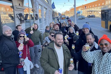 a group of people standing in front of Amager Bryghus Taproom