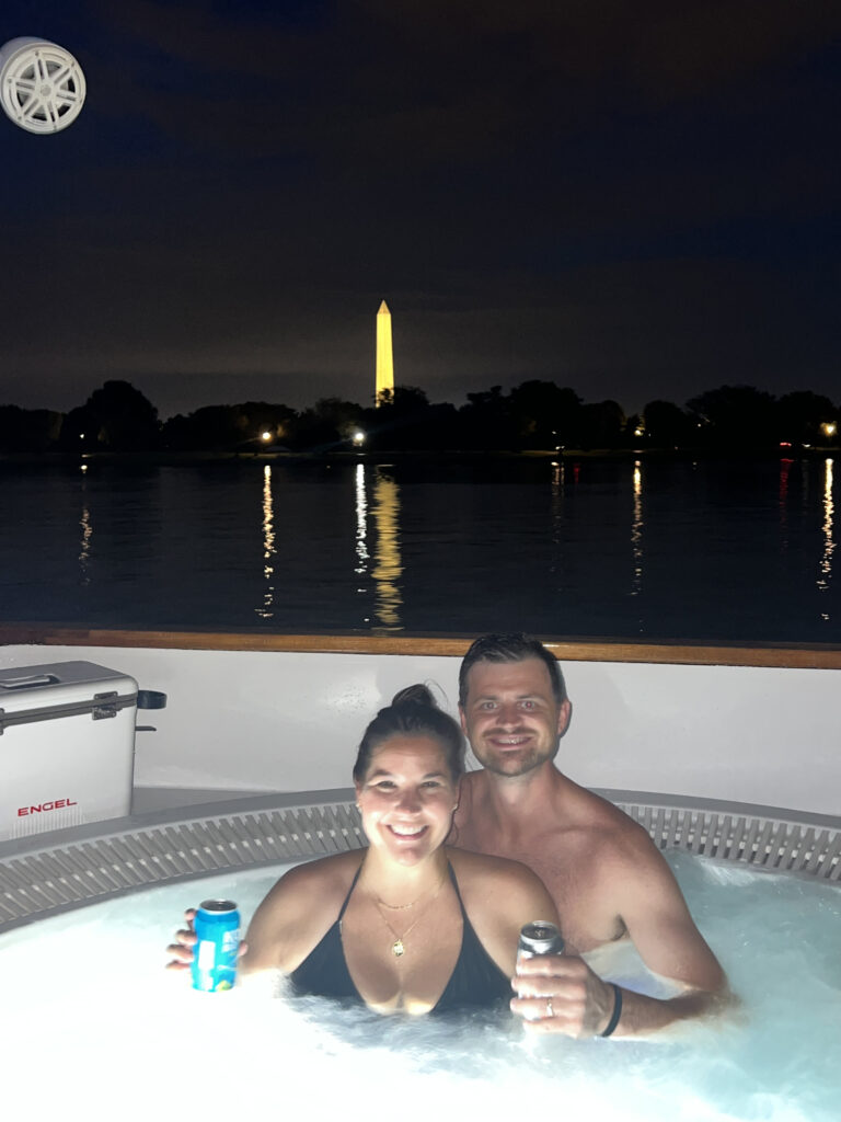 man and woman in a hot tub boat on romantic date night in Washington DC