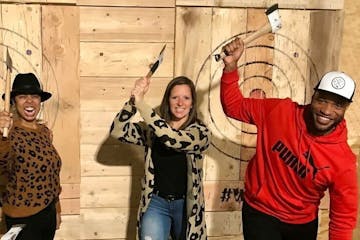 a group of people posing for the camera axe throwing at splitting edge axe throwing - coatesville