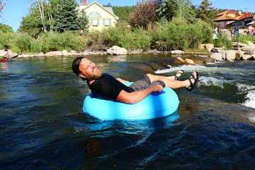 a man tubing on a body of water with pagosa adventure in pagosa springs, colorado