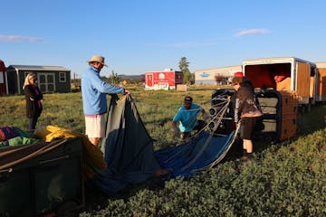 a group of two setting up pagosa adventure's hot air balloon in pagosa springs, colorado