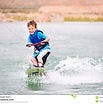 a person riding a wave on top of a body of water