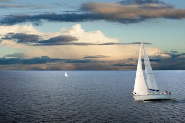 two sailboats on the ocean