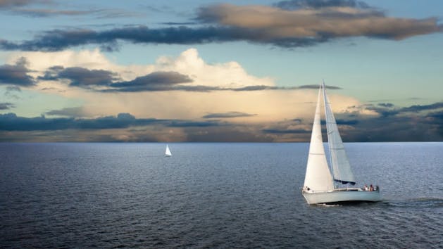 two sailboats on the ocean