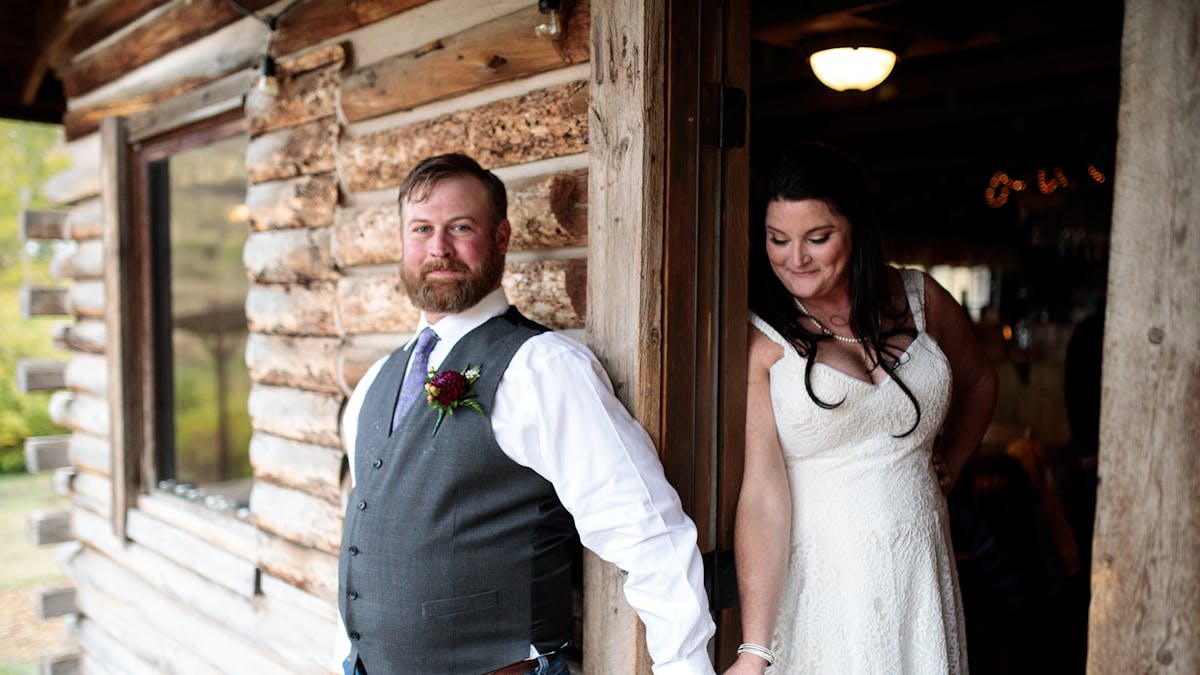 Couple holding hands at Ranch wedding Vail CO
