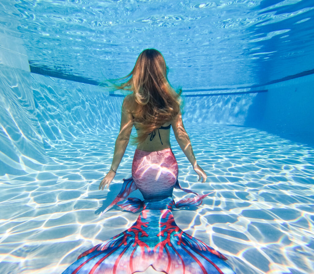 mermaiding in a pool
