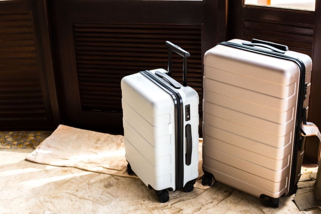 a microwave oven sitting on top of a suitcase