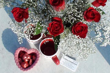 an image of roses. apple cider, and strawberries