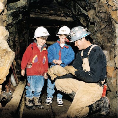 a miner explaining to kids all about mining with country boy mine in breckenridge, colorado