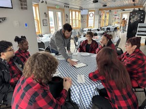 a group of people sitting at a table