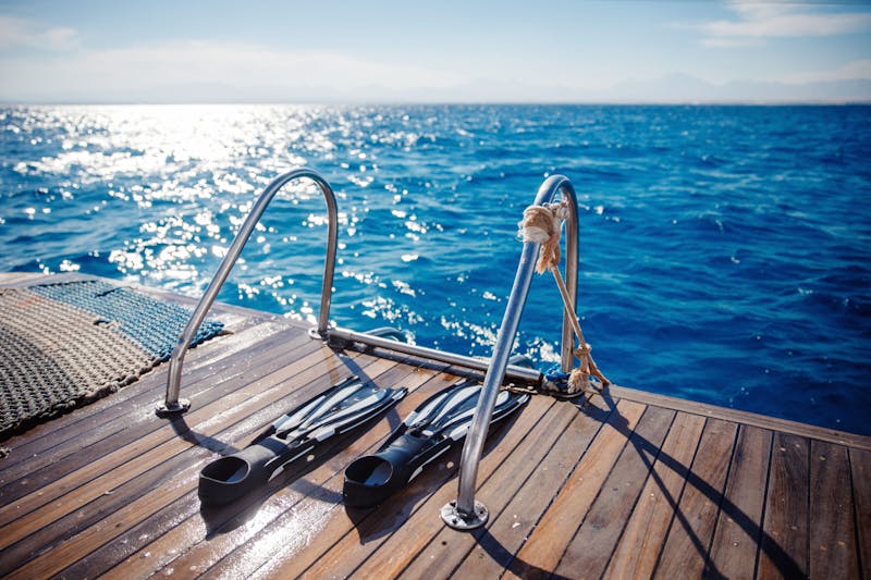 a wooden pier next to a body of water