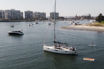 a small boat in a harbor next to a body of water