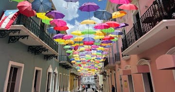 a colorful umbrella next to a building