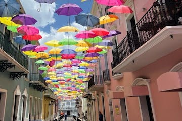 a colorful umbrella next to a building